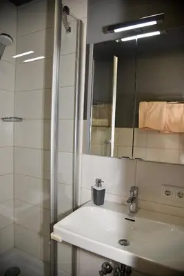 Ein Badezimmer in der Unterkunft Pension Langerspacher
