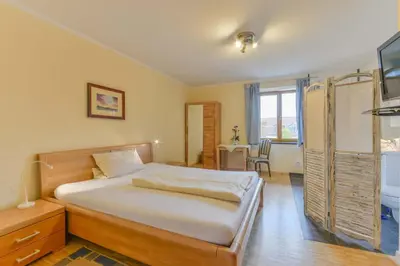 Ein Bett oder Betten in einem Zimmer der Unterkunft Haus am Gries