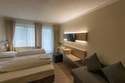 Ein Bett oder Betten in einem Zimmer der Unterkunft Ahorn Hotel