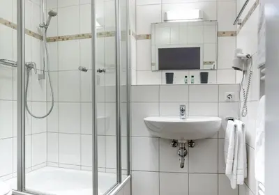 Ein Badezimmer in der Unterkunft Werdenfelser Hof
