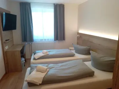 Ein Bett oder Betten in einem Zimmer der Unterkunft Pension Dorfstraße 6