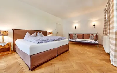 Ein Bett oder Betten in einem Zimmer der Unterkunft Olympiahaus