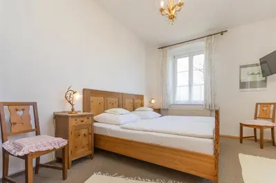 Ein Bett oder Betten in einem Zimmer der Unterkunft Villa Waldfrieden - Ferienwohnungen und -Haus