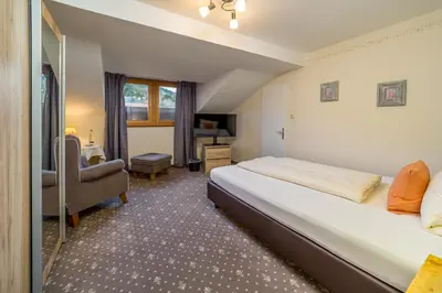 Ein Bett oder Betten in einem Zimmer der Unterkunft Gästehaus Linsinger