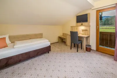 Ein Bett oder Betten in einem Zimmer der Unterkunft Gästehaus Linsinger