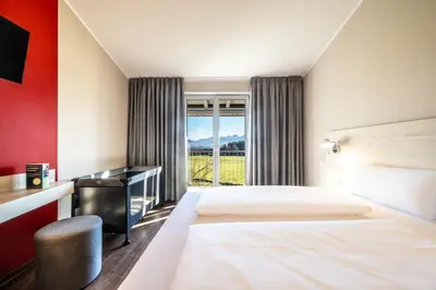 Ein Bett oder Betten in einem Zimmer der Unterkunft Coffee Fellows Hotel Irschenberg Süd