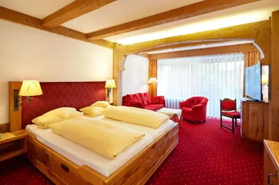 Ein Bett oder Betten in einem Zimmer der Unterkunft Kurhotel Eichinger