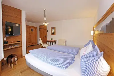 Ein Bett oder Betten in einem Zimmer der Unterkunft Gästehaus Lechner
