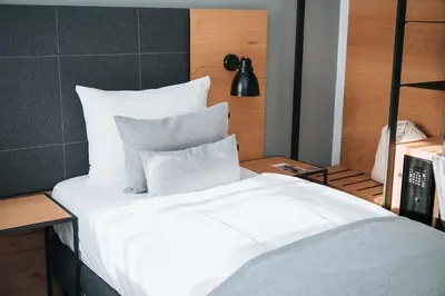 Ein Bett oder Betten in einem Zimmer der Unterkunft Coffee Fellows Hotel Puchheim