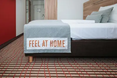 Ein Bett oder Betten in einem Zimmer der Unterkunft Coffee Fellows Hotel Puchheim