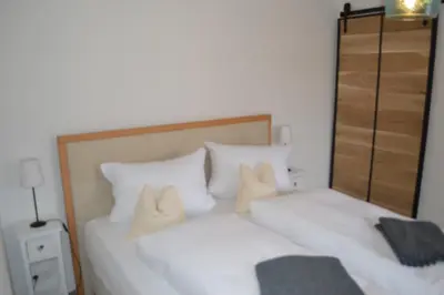 Ein Bett oder Betten in einem Zimmer der Unterkunft Gästehaus Baier am Bad
