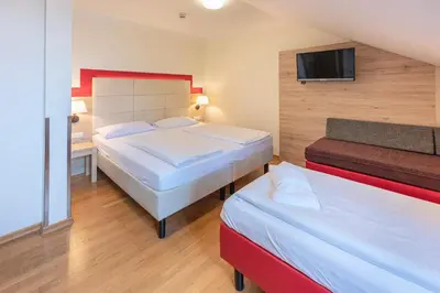 Ein Bett oder Betten in einem Zimmer der Unterkunft Hotel Eder