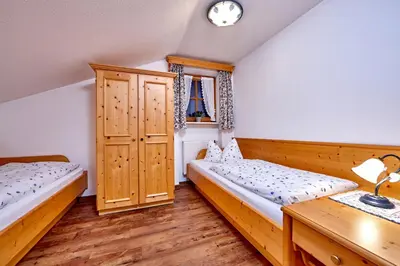 Ein Bett oder Betten in einem Zimmer der Unterkunft Gästehaus Anneliese