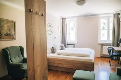 Ein Bett oder Betten in einem Zimmer der Unterkunft Angermühle Landgasthof