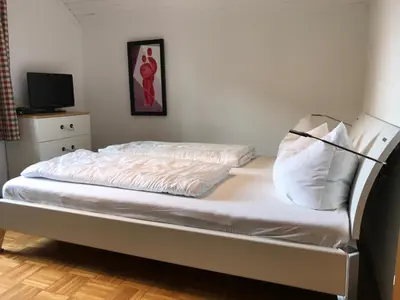 Ein Bett oder Betten in einem Zimmer der Unterkunft Ferienwohnung am Seidlpark