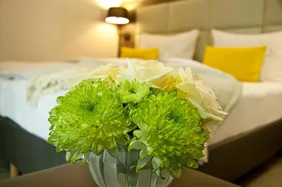 Ein Bett oder Betten in einem Zimmer der Unterkunft Hotel Am Moosrain Garni