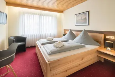 Ein Bett oder Betten in einem Zimmer der Unterkunft Hotel Leitner