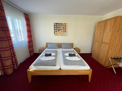 Ein Bett oder Betten in einem Zimmer der Unterkunft Hotel Leitner