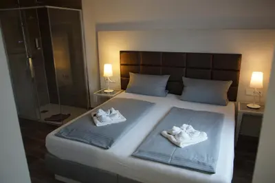 Ein Bett oder Betten in einem Zimmer der Unterkunft Hotel Leitner