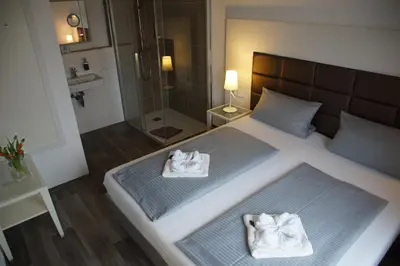 Ein Bett oder Betten in einem Zimmer der Unterkunft Hotel Leitner