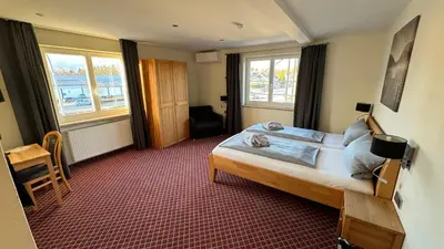 Ein Bett oder Betten in einem Zimmer der Unterkunft Hotel Leitner