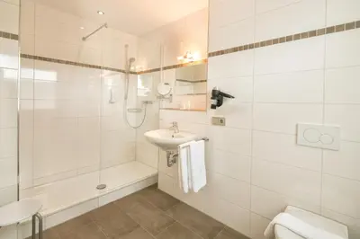 Ein Badezimmer in der Unterkunft Hotel Leitner