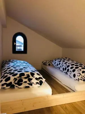 Ein Bett oder Betten in einem Zimmer der Unterkunft Ferienwohnung Zum Fiaker