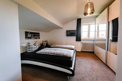Ein Bett oder Betten in einem Zimmer der Unterkunft Karwendellounge