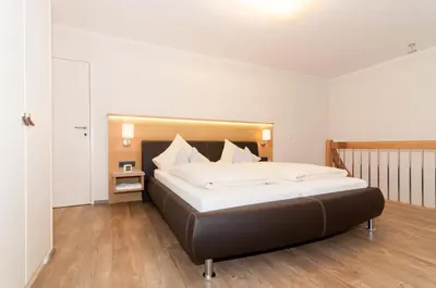 Ein Bett oder Betten in einem Zimmer der Unterkunft Ferienwohnungen Trinkl
