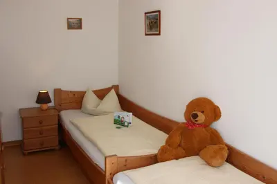 Ein Bett oder Betten in einem Zimmer der Unterkunft Ferienhof Off