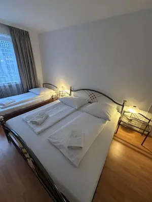 Ein Bett oder Betten in einem Zimmer der Unterkunft Hotel-Pension Asta