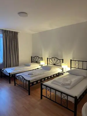 Ein Bett oder Betten in einem Zimmer der Unterkunft Hotel-Pension Asta