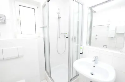 Ein Badezimmer in der Unterkunft Hotel Altmünchen by Blattl