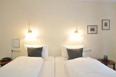 Ein Bett oder Betten in einem Zimmer der Unterkunft Hotel Altmünchen by Blattl