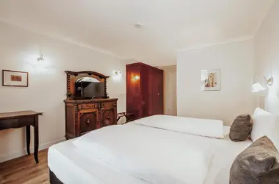 Ein Bett oder Betten in einem Zimmer der Unterkunft Hotel Altmünchen by Blattl