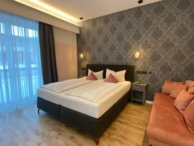 Ein Bett oder Betten in einem Zimmer der Unterkunft Alte Postvilla