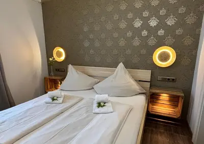 Ein Bett oder Betten in einem Zimmer der Unterkunft Alte Postvilla