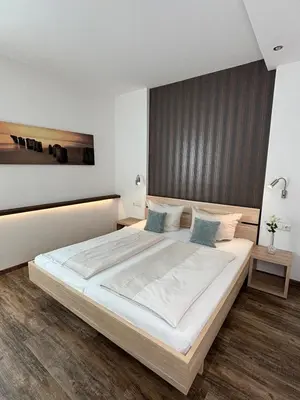 Ein Bett oder Betten in einem Zimmer der Unterkunft Alte Postvilla