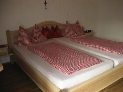 Ein Bett oder Betten in einem Zimmer der Unterkunft Gästehaus Proisl