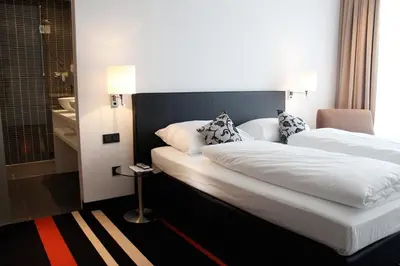 Ein Bett oder Betten in einem Zimmer der Unterkunft enso Hotel