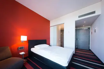 Ein Bett oder Betten in einem Zimmer der Unterkunft enso Hotel