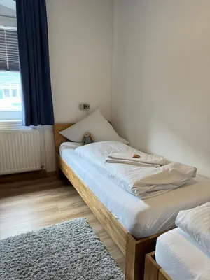 Ein Bett oder Betten in einem Zimmer der Unterkunft Hotel Hasen Kaufbeuren Allgäu