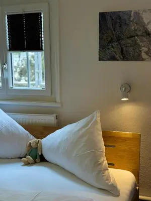 Ein Bett oder Betten in einem Zimmer der Unterkunft Hotel Hasen Kaufbeuren Allgäu