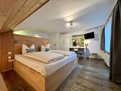 Ein Bett oder Betten in einem Zimmer der Unterkunft Gästehaus Alpvital
