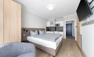 Ein Bett oder Betten in einem Zimmer der Unterkunft centerroom München City