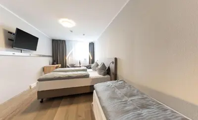 Ein Bett oder Betten in einem Zimmer der Unterkunft centerroom München City