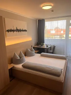 Ein Bett oder Betten in einem Zimmer der Unterkunft centerroom München City