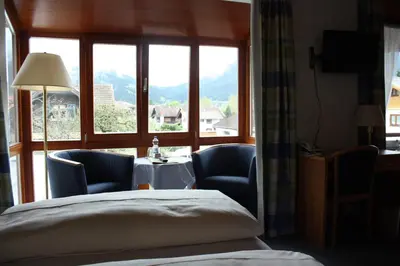Ein Bett oder Betten in einem Zimmer der Unterkunft Hotel Garni Otto Huber