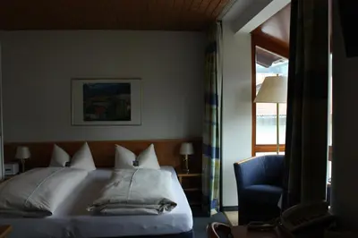 Ein Bett oder Betten in einem Zimmer der Unterkunft Hotel Garni Otto Huber