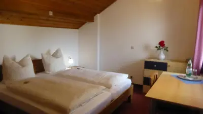 Ein Bett oder Betten in einem Zimmer der Unterkunft Haus Rosmarin